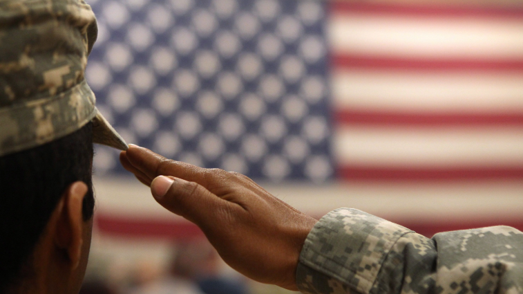 Older man speaking outdoors with intense expression, related to US service member in Iran attacks.