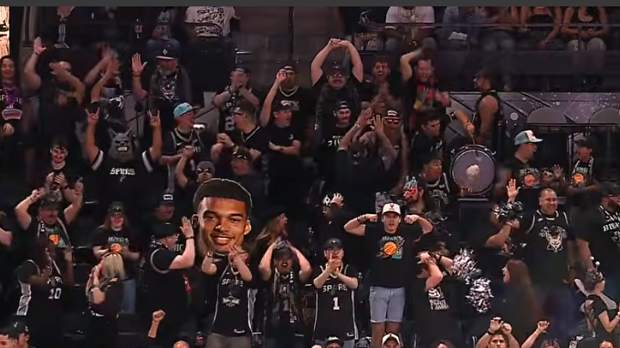 San Antonio Spurs playoffs celebration with players and fans.