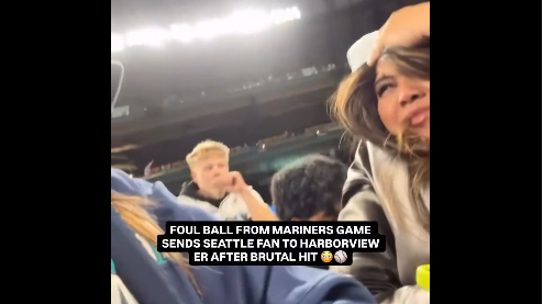 Crowd at baseball stadium during Mariners foul ball incident.