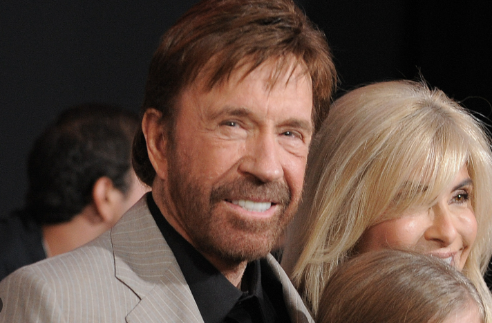 Rugged man aiming handgun in intense scene reflecting politics.