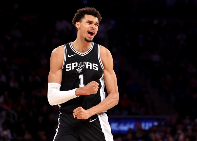 Houston sports news: Basketball player's joyful moment in arena.
