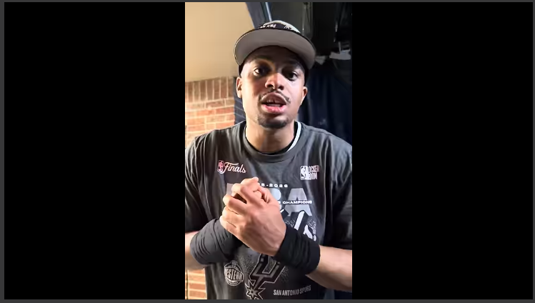 San Antonio Spurs fan excited about the playoffs, wearing team gear.