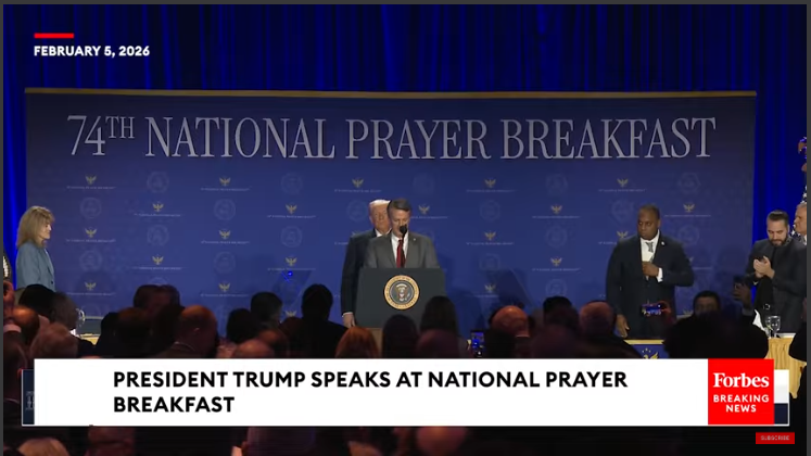 National Prayer Breakfast participants in solemn moment.