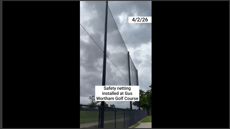 Close-up of a concerned man outdoors by a truck near grass.