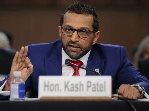 FBI Director Kash Patel Senate Hearing, two men in serious discussion.