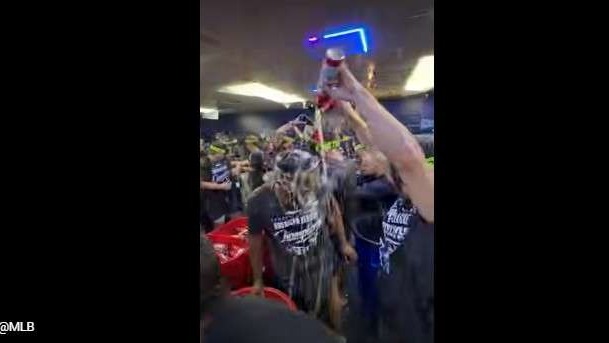 Athletic man celebrating in locker room going to the World Series.