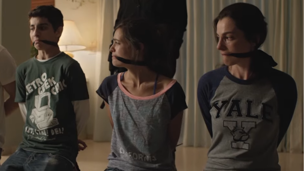 A hostage bound and gagged representing the implications of censorship on freedom of speech.