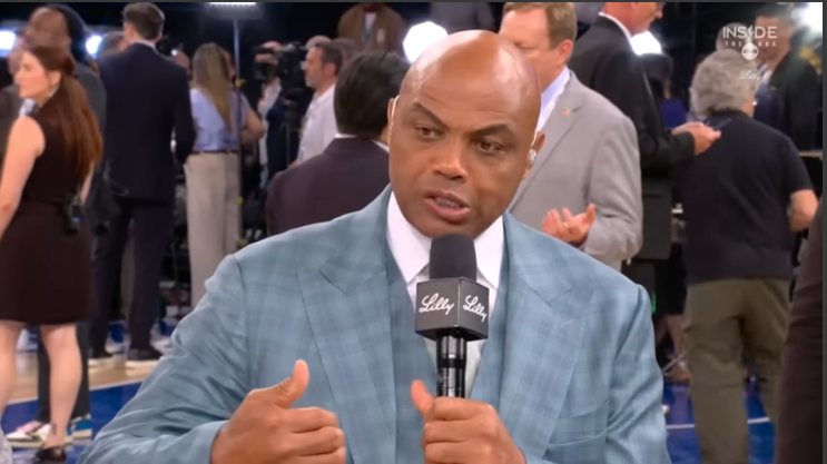 Expressive Chuck discussing in sports studio, dynamic expression.