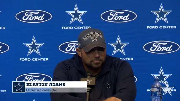 Football coach discussing improvement on early downs at press conference.