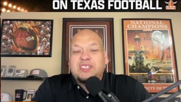 Texas Longhorns football player and coach celebrating, conveying team spirit.