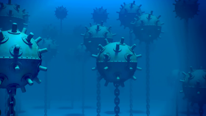 Armed soldier monitors sea activities from a ship near Strait of Hormuz.