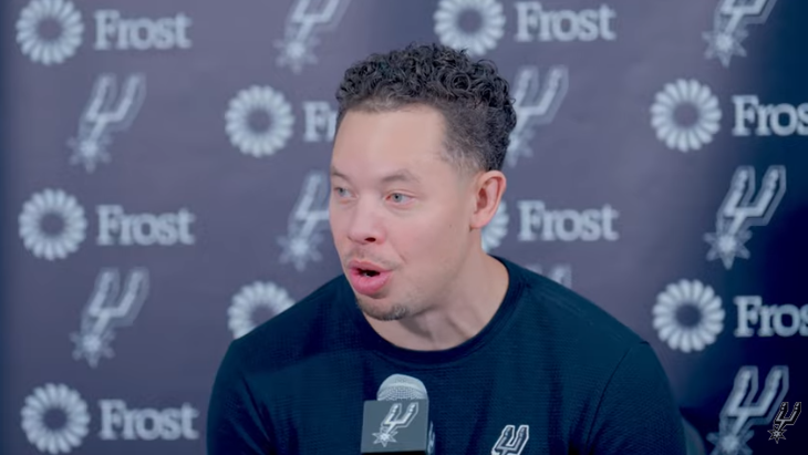 Basketball team celebrating consistency in sports, post-game.