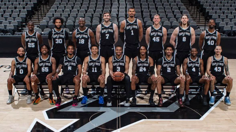 San Antonio Spurs news: Intense basketball game scene with players in action.