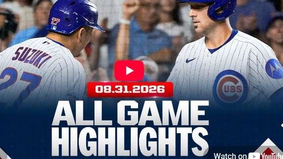 Cubs players discussing game, vibrant stadium scene