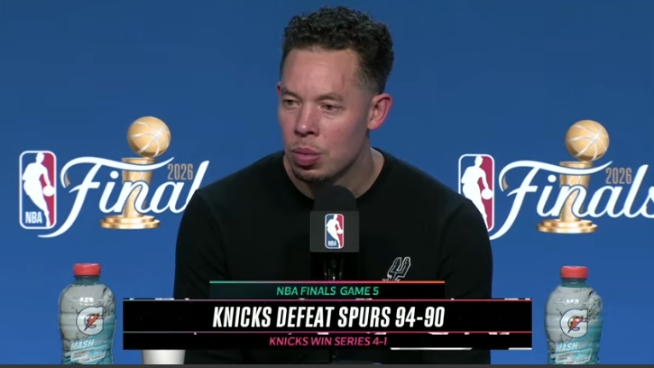 Two commentators discuss the NBA Finals in a studio setting.