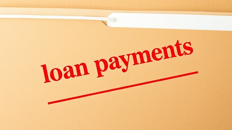 Student loan repayment struggles highlighted on a manila folder.