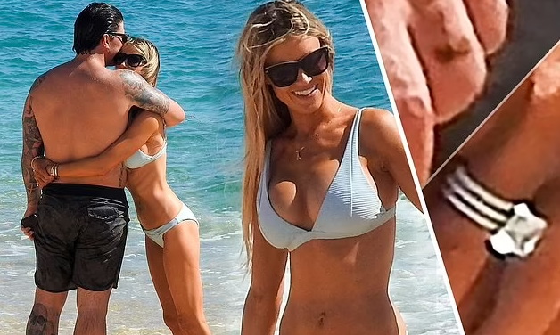 Attractive woman with long blonde hair in lush green setting