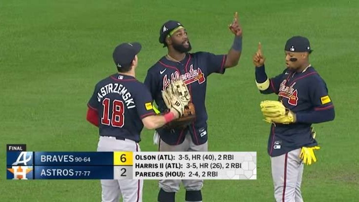 Braves players celebrating postseason spot on the field.
