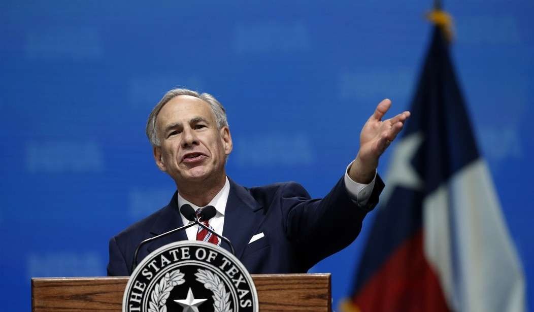 Texas governor news with smiling man greeting a crowd.