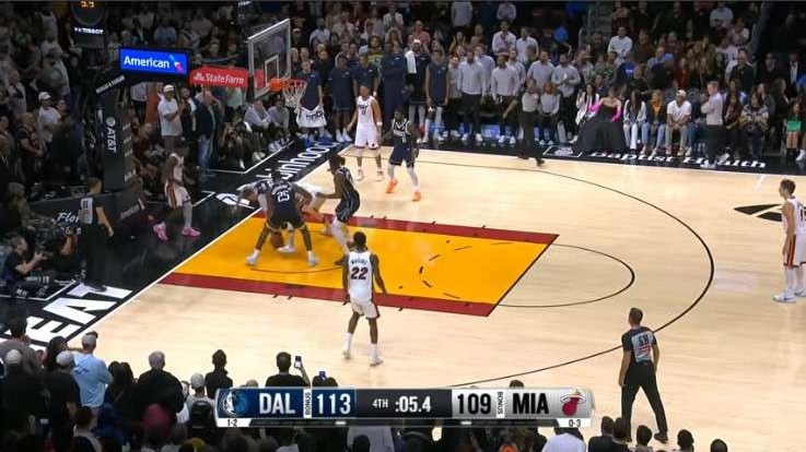 Intense Dallas Mavericks game promo with players and date.