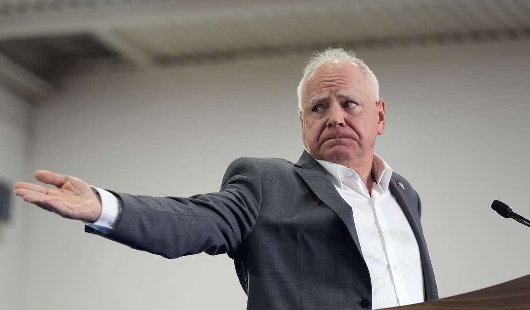 Walz departure from 2026 race, older man speaking at press conference.