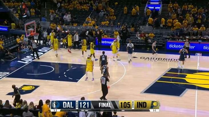 Dallas Mavericks game promotional featuring players and date.