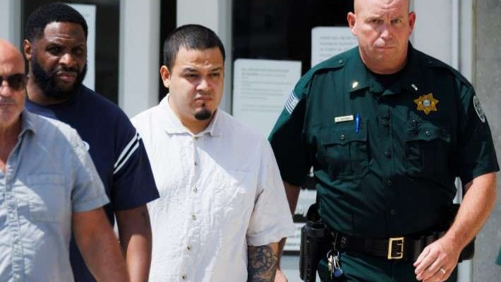 Kilmar Abrego Garcia at an outdoor event, looking focused.