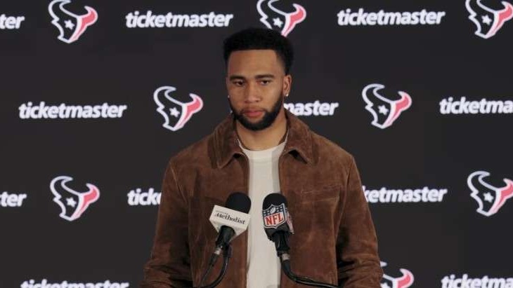 Texans Need to Finish Games: Person at press conference gesturing animatedly.