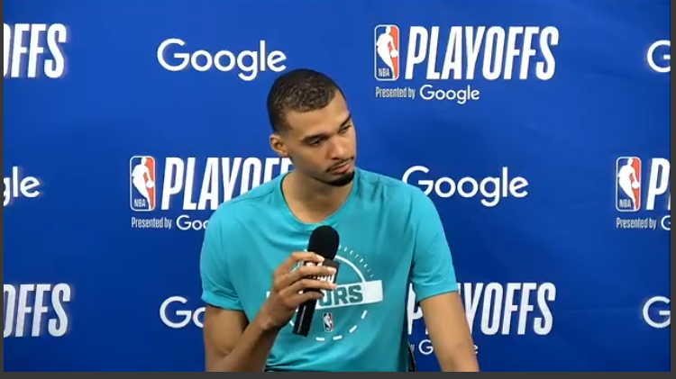 San Antonio Spurs player at press conference after game.