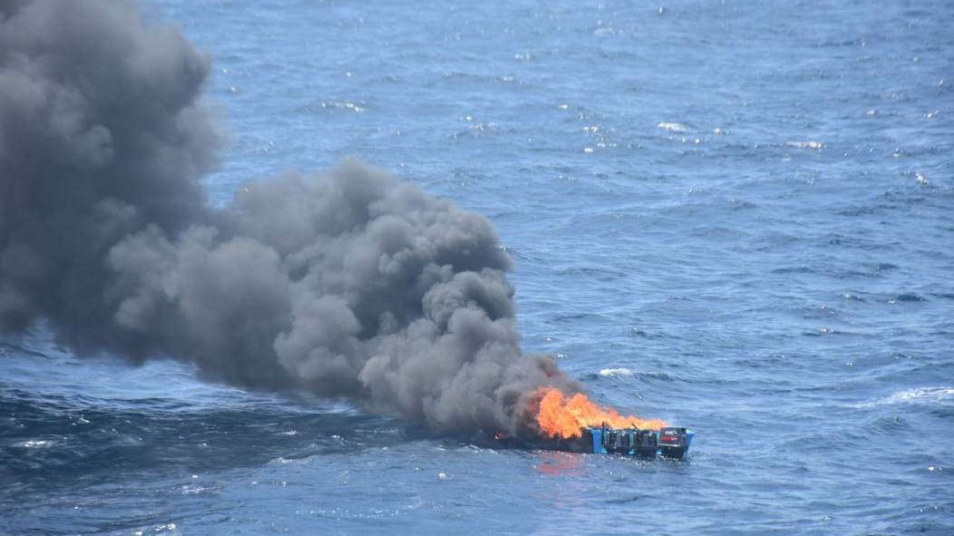 Serious older man in formal setting reflecting breaking national news.