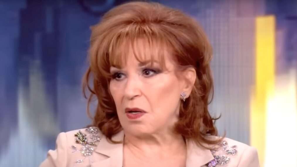 TV host discussing Trump National Guard deployment in a studio setting.