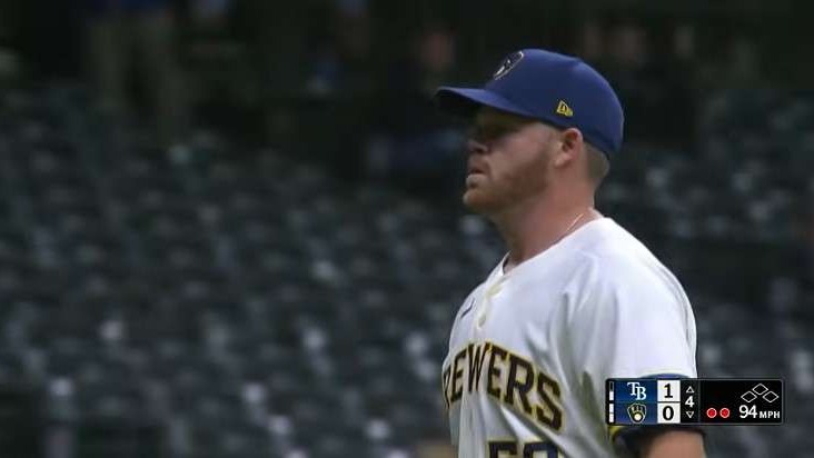 Brandon Woodruff on World Series roster, pitching action in baseball game.