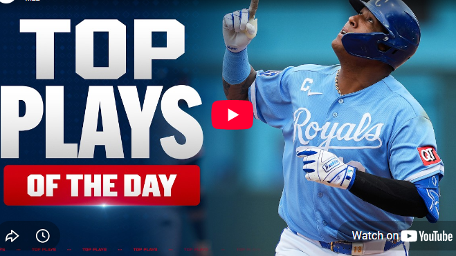 Salvador Perez ties home run record, celebrating on field.
