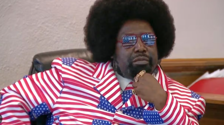 Patriotic man in stars and stripes suit showcases Afroman independence story.