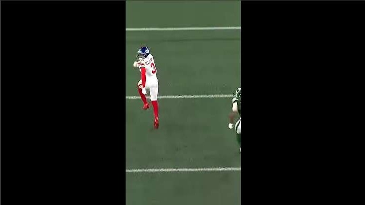 Football player executing a strategic move on the field.
