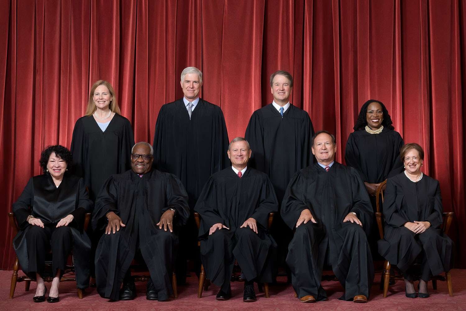 Supreme Court justices in formal robes, posed together.
