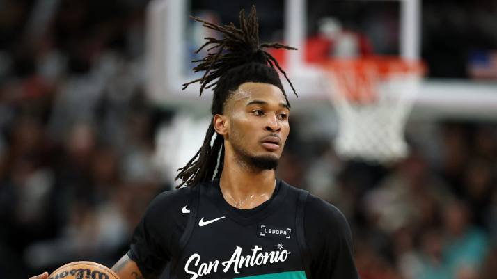San Antonio Spurs player dribbling in game recap.