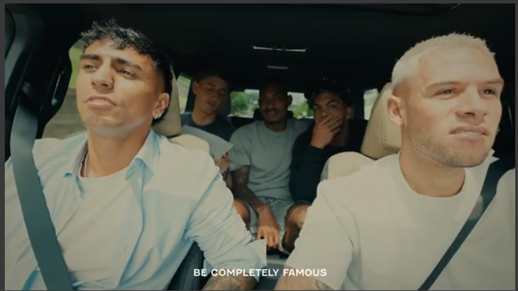 Friends enjoy the joy of driving, smiling inside a car.